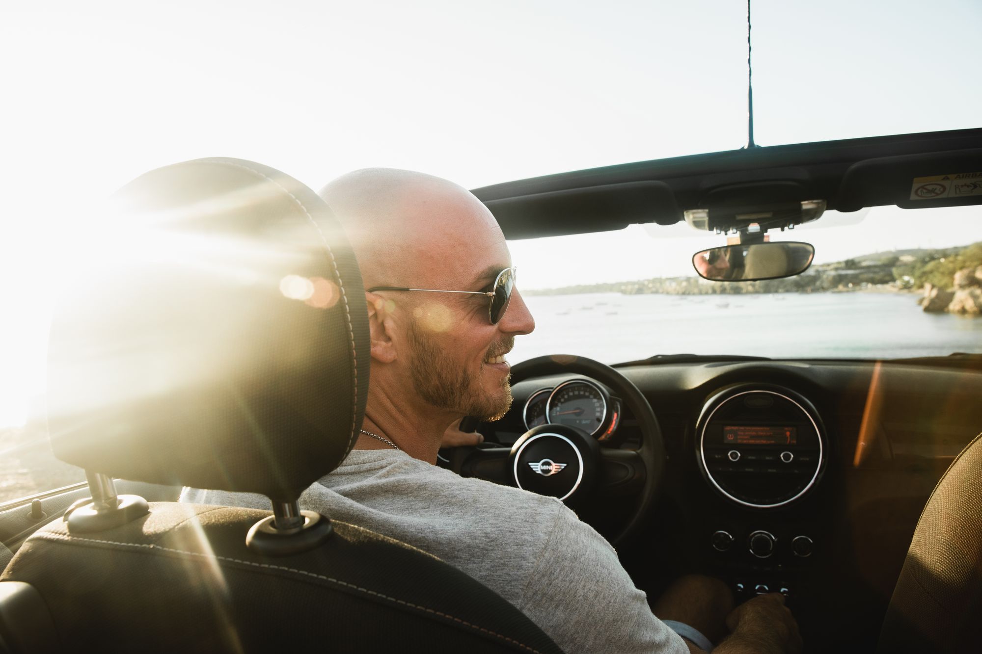 man driving car