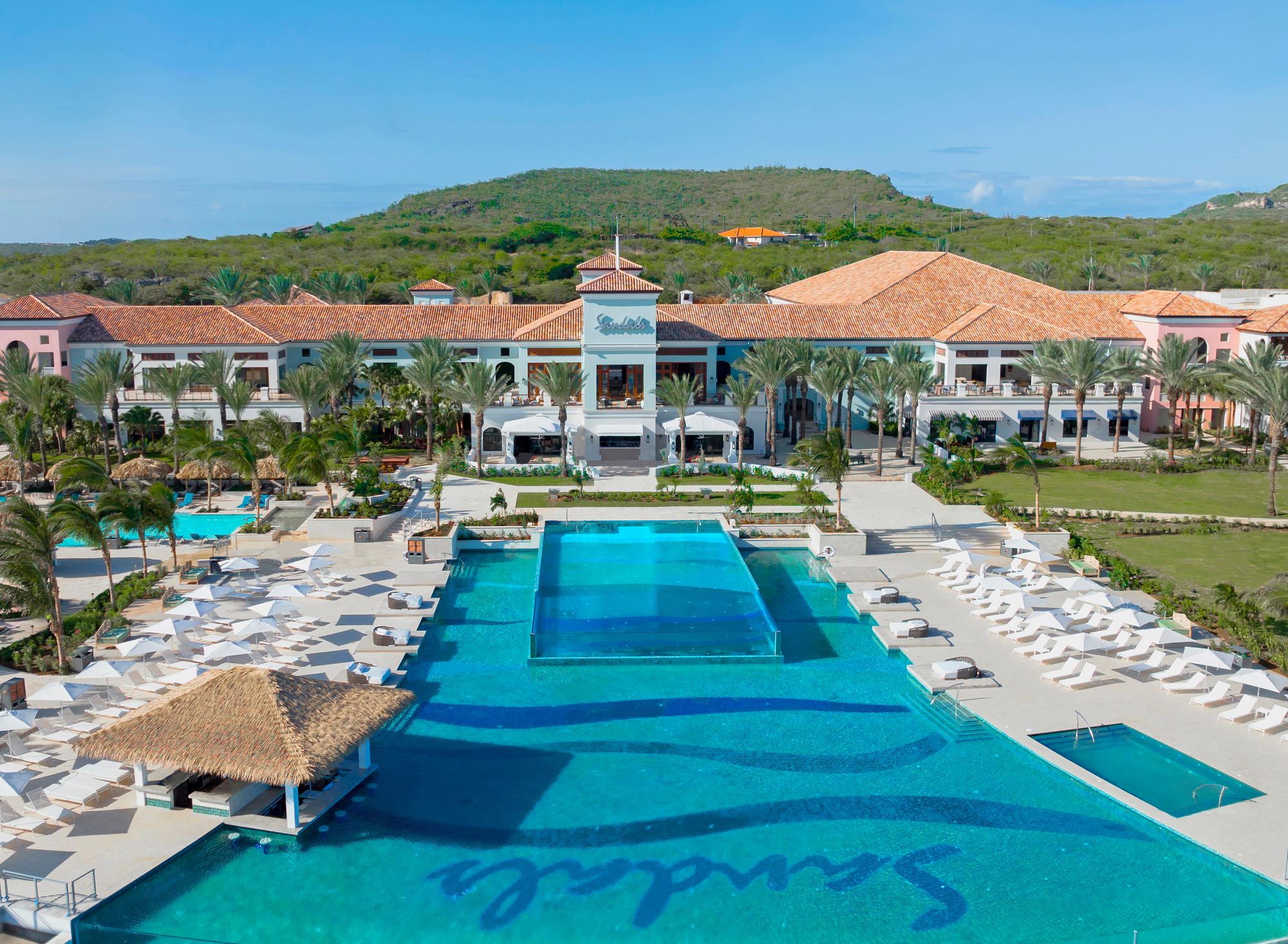 Dos-Awa-Infinity-Pool-at-Sandals-Royal-Curacao-with-expansive-upper-and-lower-decks-overlooking-the-Spanish-Water-and-the-rugged-mountain-landscape--1-