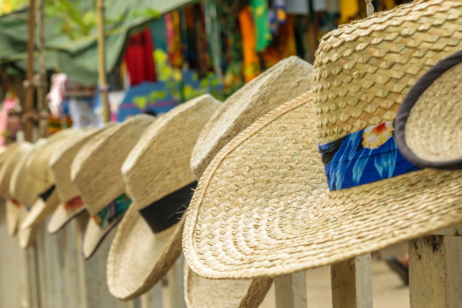 Summer beach hats on display at craft market for sale in Montego Bay Jamaica