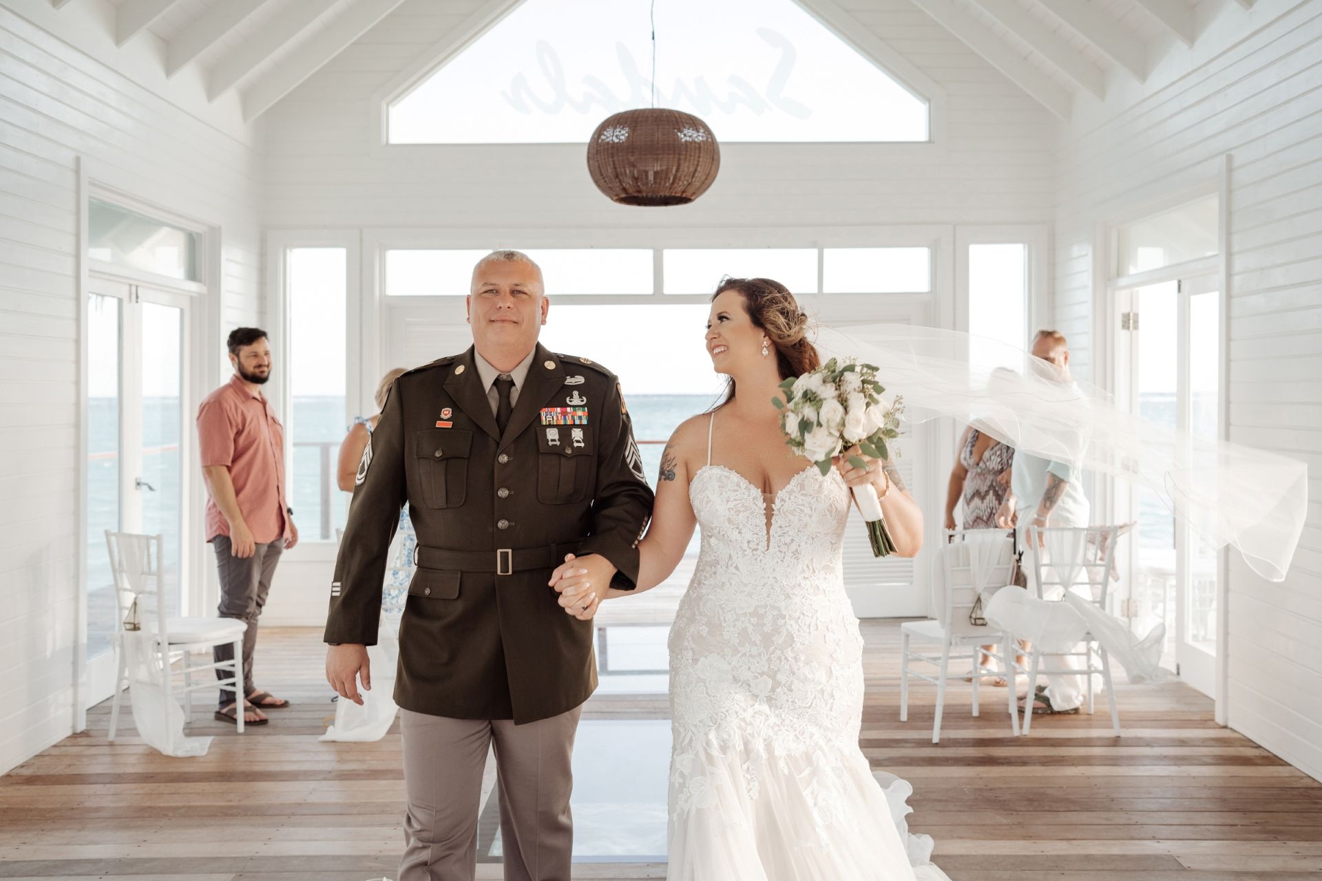 bride_groom_holding_hands_leaving_chapel_olga_sam
