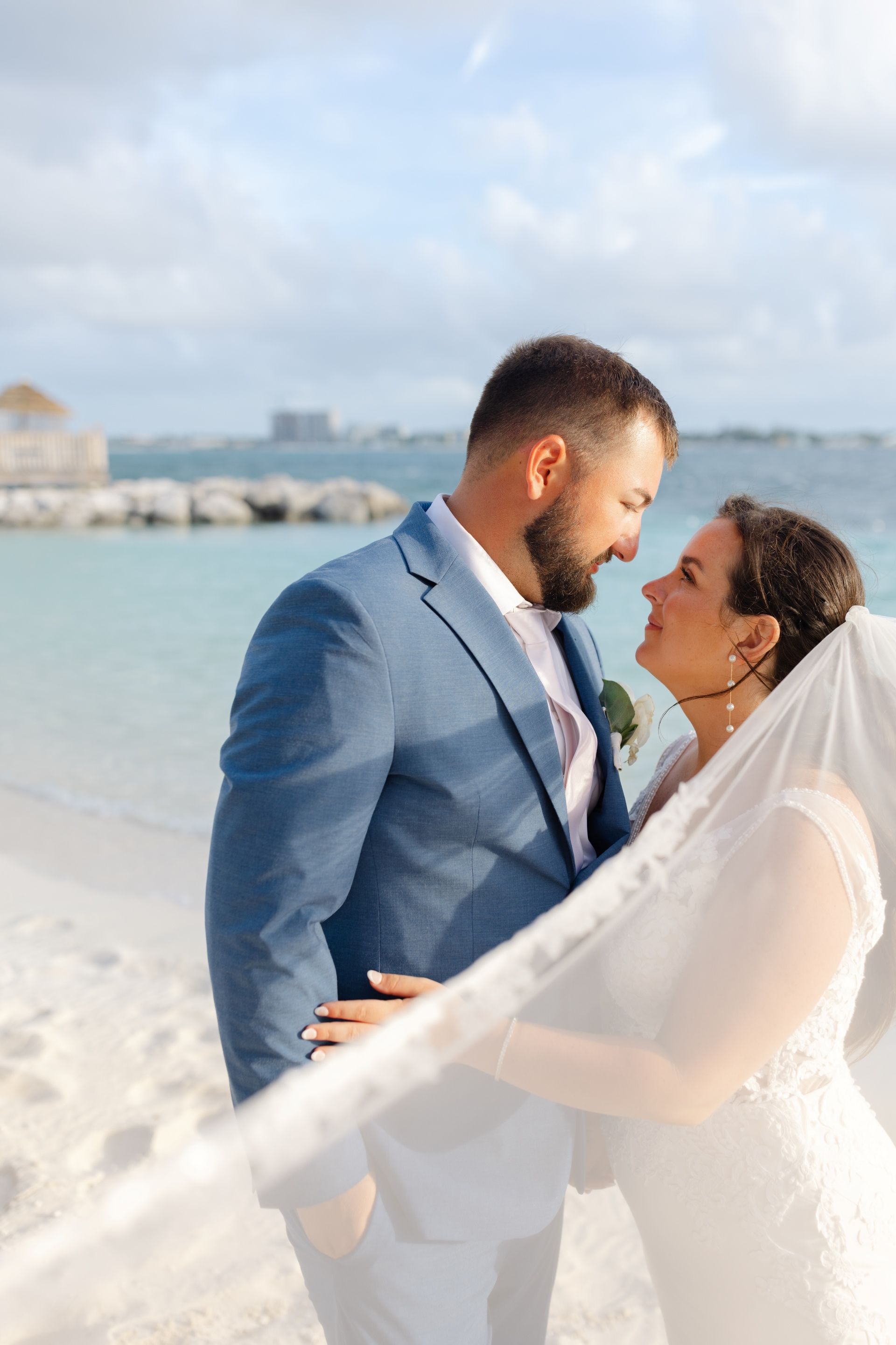 bride-groom-gazing-shore-sandals-royal-bahamian