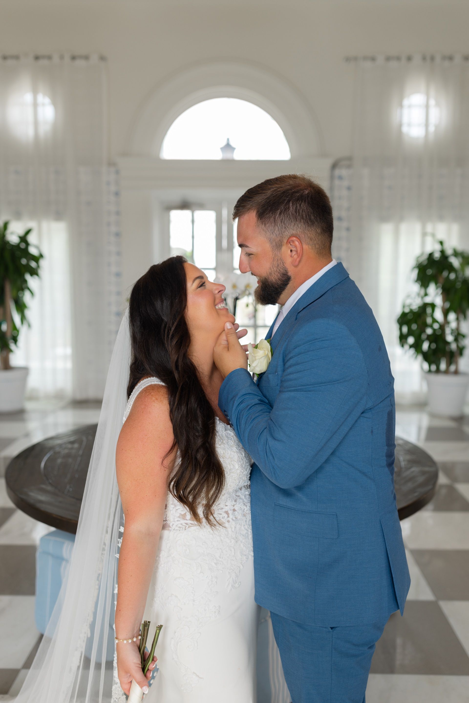 groom-touching-bride-face-smiling