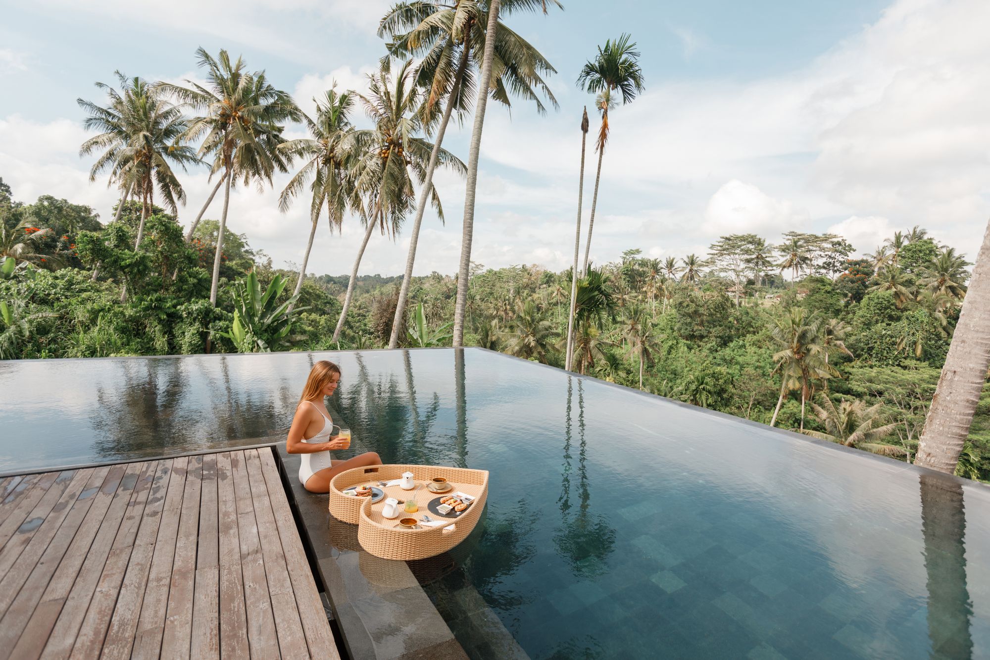 woman with pool tray with food Bali