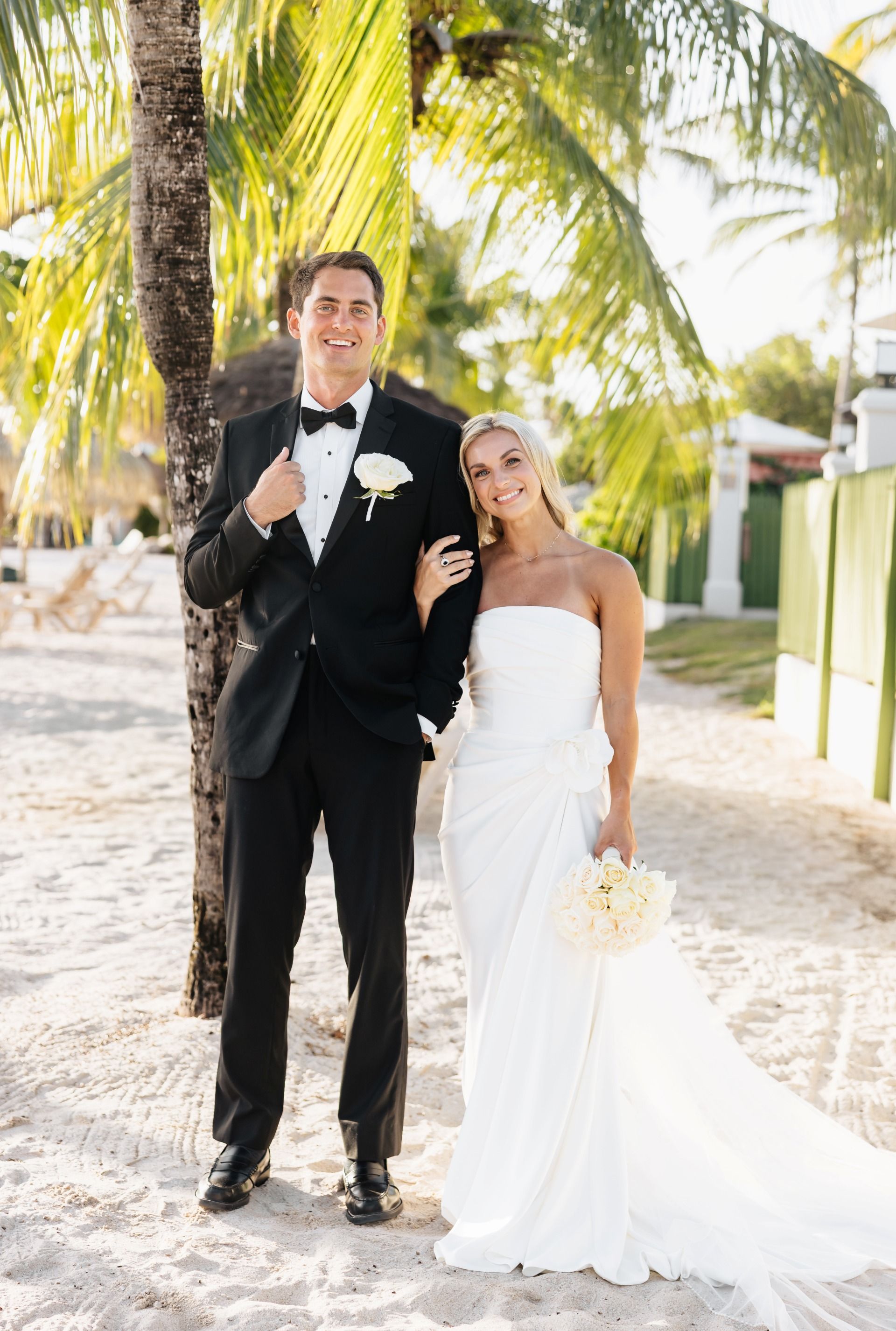 newlywed couple relaxing together at their St. Lucia beach wedding