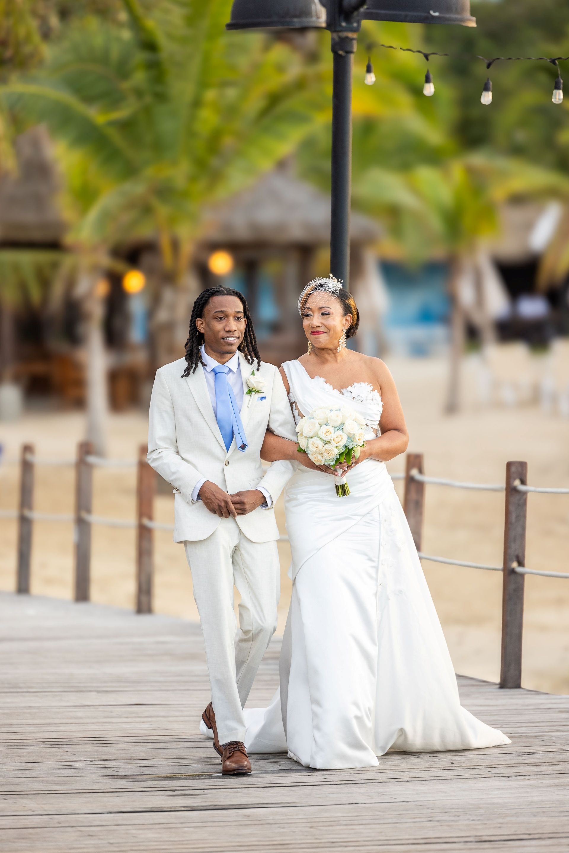 schellie-walking-with-son-before-sandals-ochi-wedding-1